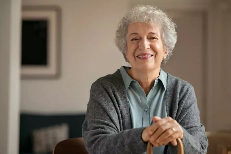 Breathe helped Mary S., a smiling elderly woman seated with confidence.